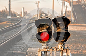 Traffic light shows red signal on railway