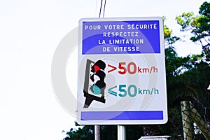 Traffic light speed limit 50 road sign panel radar enforced for car go slowly in french street