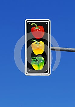 traffic light with three bell peppers, paprika in red, yellow and green