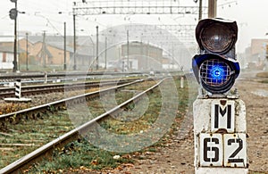 Traffic lights near the railway tracks on the autumn_