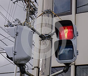 Traffic lights for pedestrian showing the red