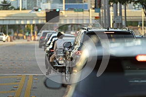 Traffic lights regulating driving cars on city street in Miami, Florida