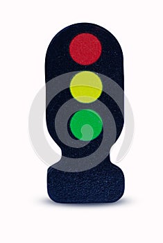 Traffic lights - toy made of wood small isolated on white background.