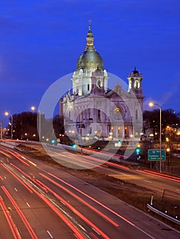 Traffic in Minneapolis at dusk with church