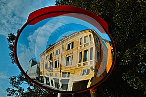 Traffic mirror reflecting Mediterranean residence
