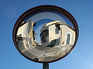 Traffic mirror reflecting small town