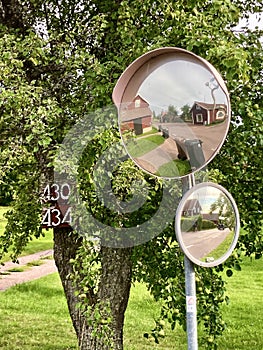 Traffic mirrors in a Swedish village reflecting the village photo