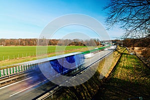 Traffic on motorway with motion blurred cars