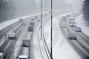 Traffic On Motorway During Snowstorm