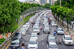 Traffic moves slowly along a busy road in Bangkok, Thailand