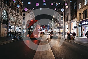 Traffic on New Oxford Street decorated with Christmas Lights, London, UK