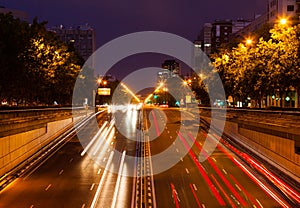 Traffic at Paseo de la Castellana in evening. Madrid