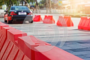 Traffic plastic barriers and pylon on road