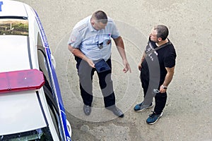 traffic police officer talking to a violator of the law. text in Russian: Traffic police