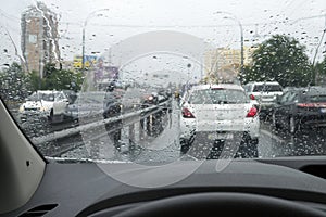 Traffic on the rainy day at the city street.