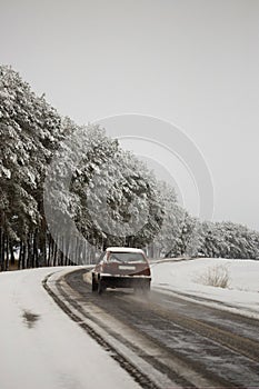 Traffic on the road in bad weather conditions in winter