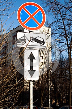 Traffic road sign Parking prohibited with Direction of sign. Evacuation on tow truck
