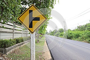 Traffic road sign yellow right intersections ahead.