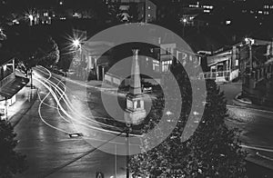 Traffic on roundabout street in city of Vranje at night photo