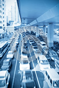 Traffic rush hour under the viaduct