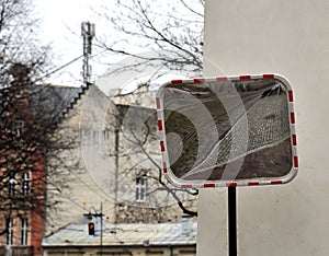 Traffic safety mirror with reflection of  old street, Krakow, Poland