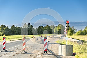 Traffic safety roadwork signs and light on highway