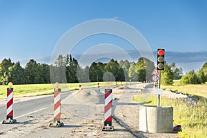 Traffic safety roadwork signs and light on highway photo