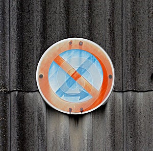 Traffic sign on a asbestos wall