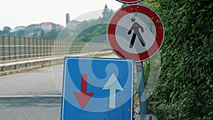 Traffic sign. blue square with red and white arrows. Road works sign. close-up. Repair work is underway on the road