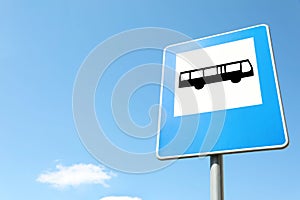 Traffic sign Bus Stop against blue sky, space for text