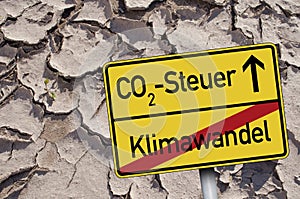 Traffic sign with CO2 Tax- Steuer and climate change - Klimawandel photo