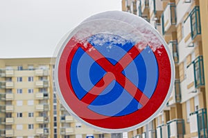 Traffic sign covered by ice and snow 4