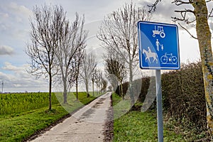 Traffic sign: Exclusive road for tractors, bicycles, horses and pedestrians, prohibited for cars or motorcycles