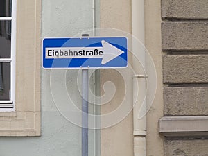 Traffic sign with the German text `EinbahnstraÃŸe` which translates into `One way` in English language