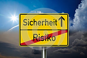 Traffic sign with the german words for Safety and risko - Sicherheit und Risiko