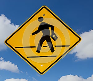 Traffic sign with graphic of a person crossing a street with a bible floating on a blue sky with clouds