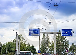 Traffic sign for 1 and 10 highways in the direction to Innsbruck, Munich,Munchen, Villach, Freilassing, Wien, Linz,Messe, Vienna photo
