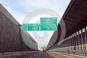 Traffic sign on italian motorway with names of city photo