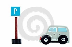 Traffic sign parking and blue toy caron white background