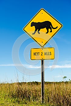 Traffic sign at the road side warns the drivers