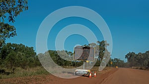 Traffic Sign On Rough Dirt Australian Outback Road