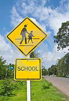 Traffic sign (School warning sign) and blue sky.