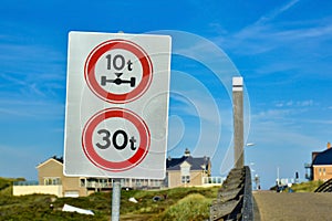 Traffic sign with sign prohibiting throroughfare of vehicles with a weight over 30t and axle weight heavier than 10t