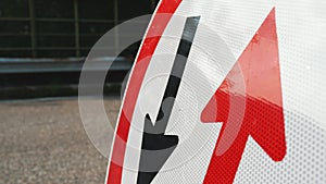 Traffic sign. Symbol. reverse movement. close-up. red and black arrows in a round red frame sign. Repair work is