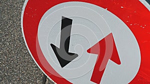 Traffic sign. Symbol. reverse movement. close-up. red and black arrows in a round red frame sign. Repair work is