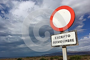 Traffic signal with cloudy sky photo