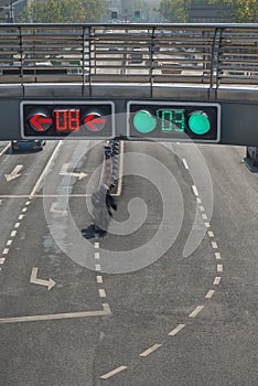 Traffic signal lights on pedestrian overpass over street road