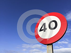 Traffic signpost speed limit forty.