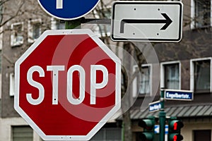 Traffic signs of caution and direction closeup