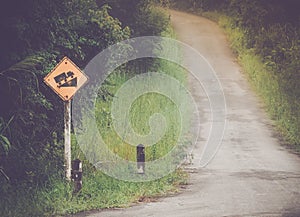 Traffic signs for road slope in rural road.